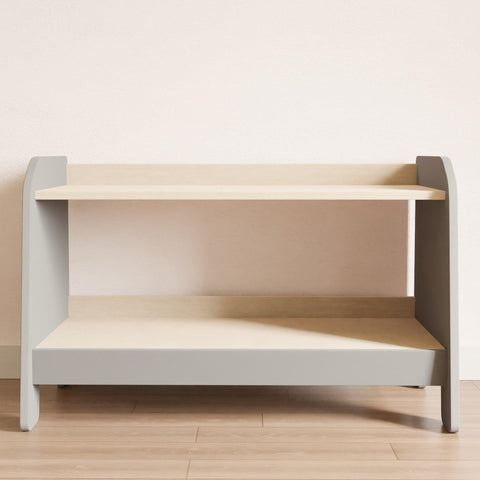 Two-shelf modern montessori toy bookcase. The sides and front are gray, and the shelves are wooden.