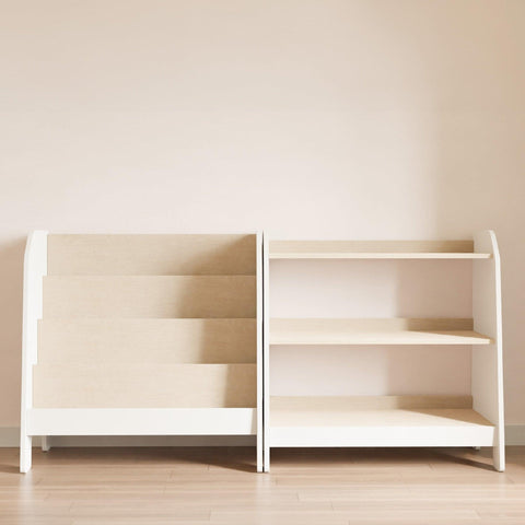 White forward facing bookshelf and montessori toy storage.