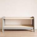 Small toy shelf with gray sides and wooden shelves.