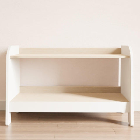 Two-shelf low toy rack. The sides and front are white, and the shelves are wooden.