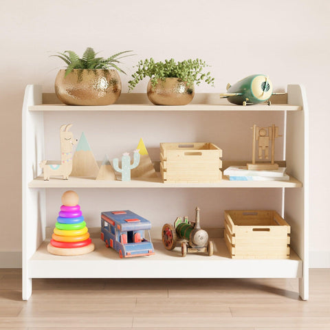 Wide montessori toy storage with three shelves, it has white sides and wooden shelves on which children's toys are arranged.