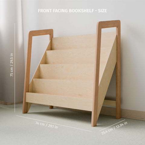 The image shows an empty front-facing Montessori-style bookshelf crafted from natural wood, demonstrating its dimensions. The height of the bookshelf is labeled as 75 cm (29.5 in), the width is 74 cm (29.1 in), and the depth is 35 cm (13.94 in). The design is minimalist, featuring visible screws on the sides, which enhance the industrial aesthetic. The shelf is placed against a soft, light-colored wall in a well-lit room, suggesting a clean and organized space ideal for children's reading materials.