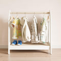 Montessori clothing storage with a shelf for accessories.