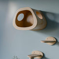 Modern wall-mounted cat furniture set featuring a wooden house, climbing steps, and a scratching post.