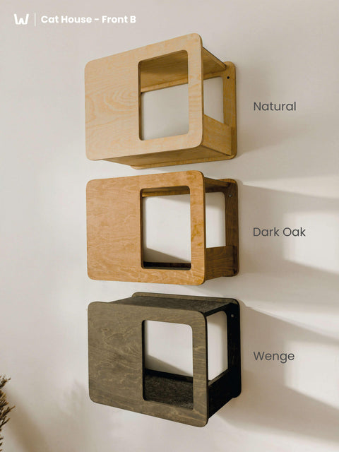 Three Wall-Mounted Cat Houses displayed vertically, showing the Front B design in available finishes: Natural, Dark Oak (Brown), and Wenge (Black). These are Floating Beds for Cats.